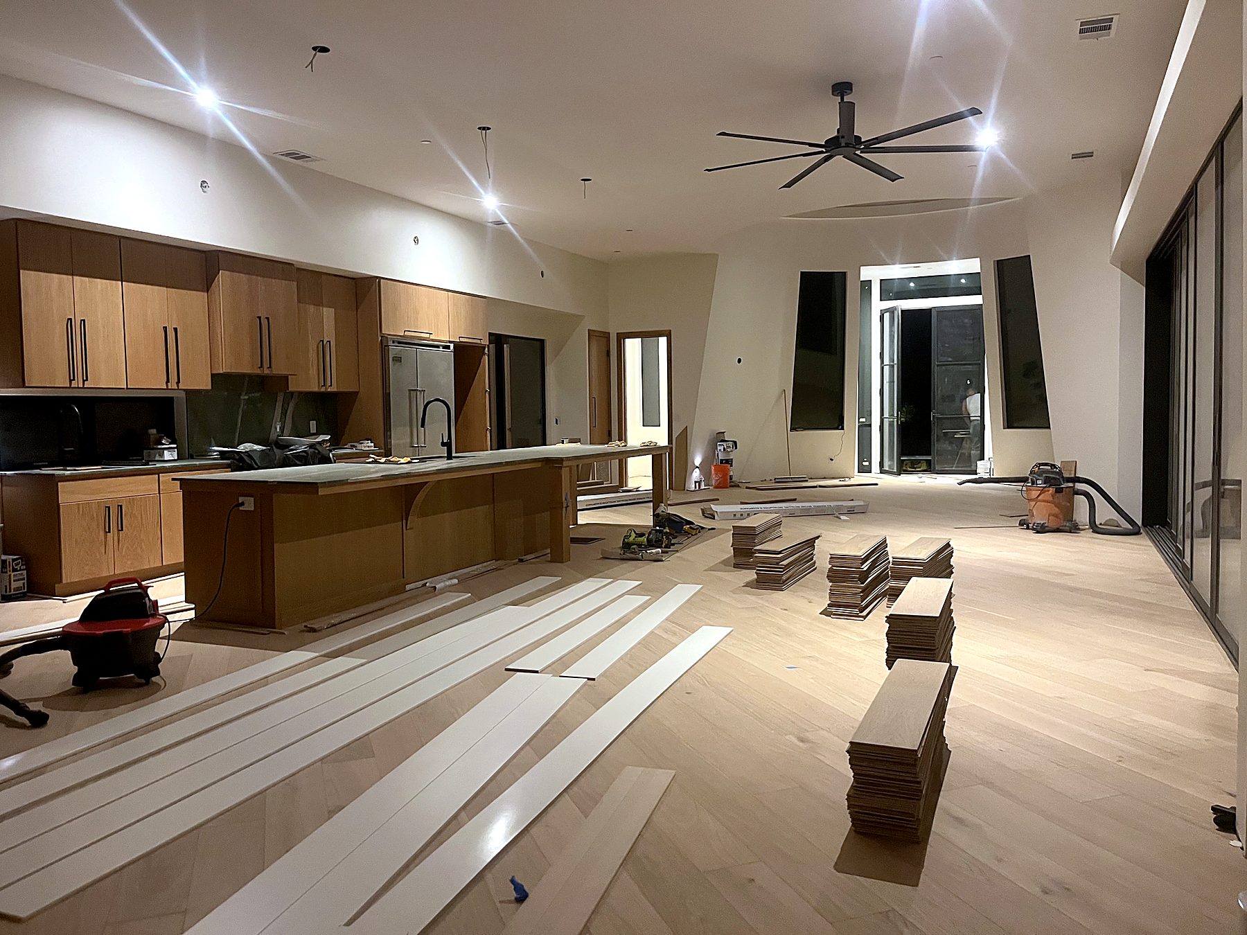Open kitchen and great room during flooring installation